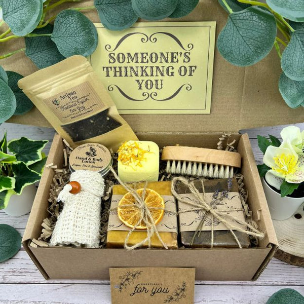 A gift box filled with handmade soap, tea and other small items