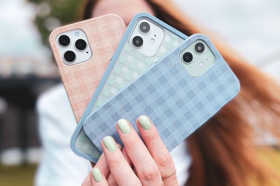 three phone cases laying on a table