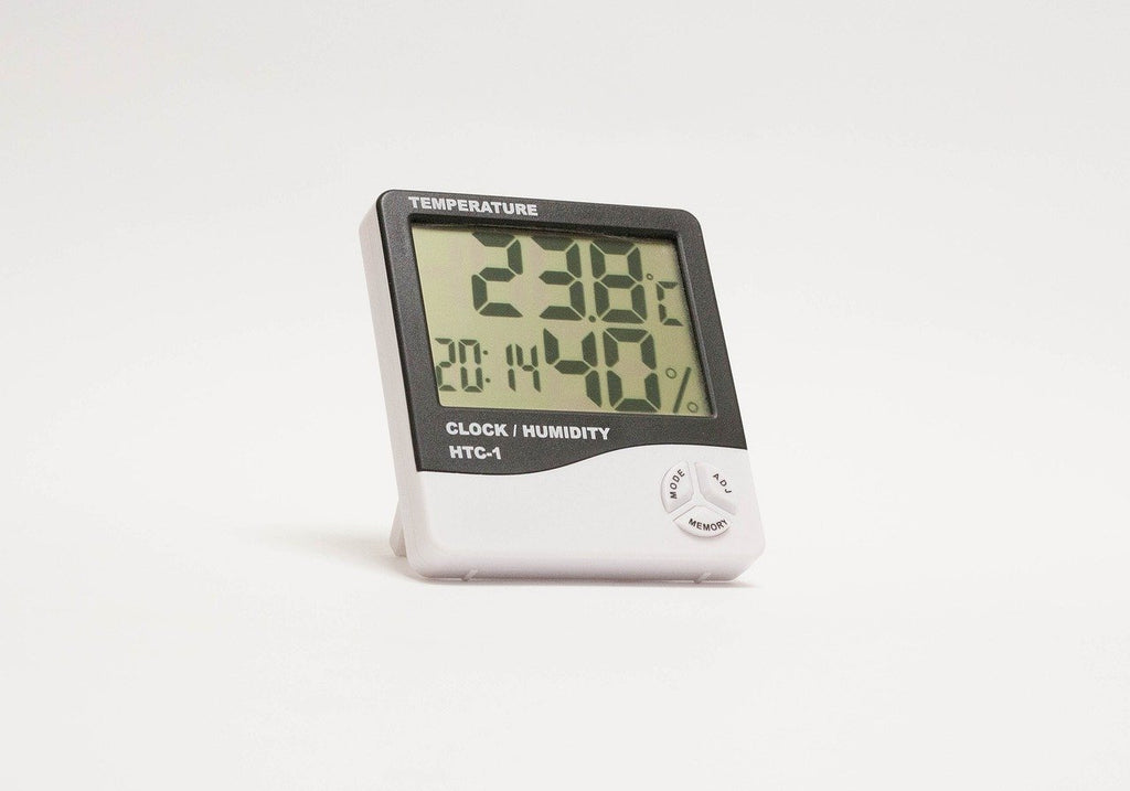 Black and white thermostat on a white backdrop