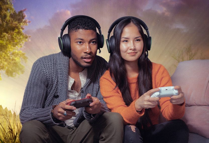 A man and woman playing xbox together
