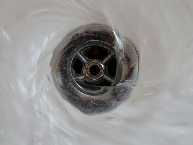 Water going down a sink steel sink drain