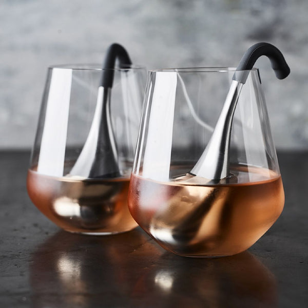 Two stainless steel wine chillers in glasses