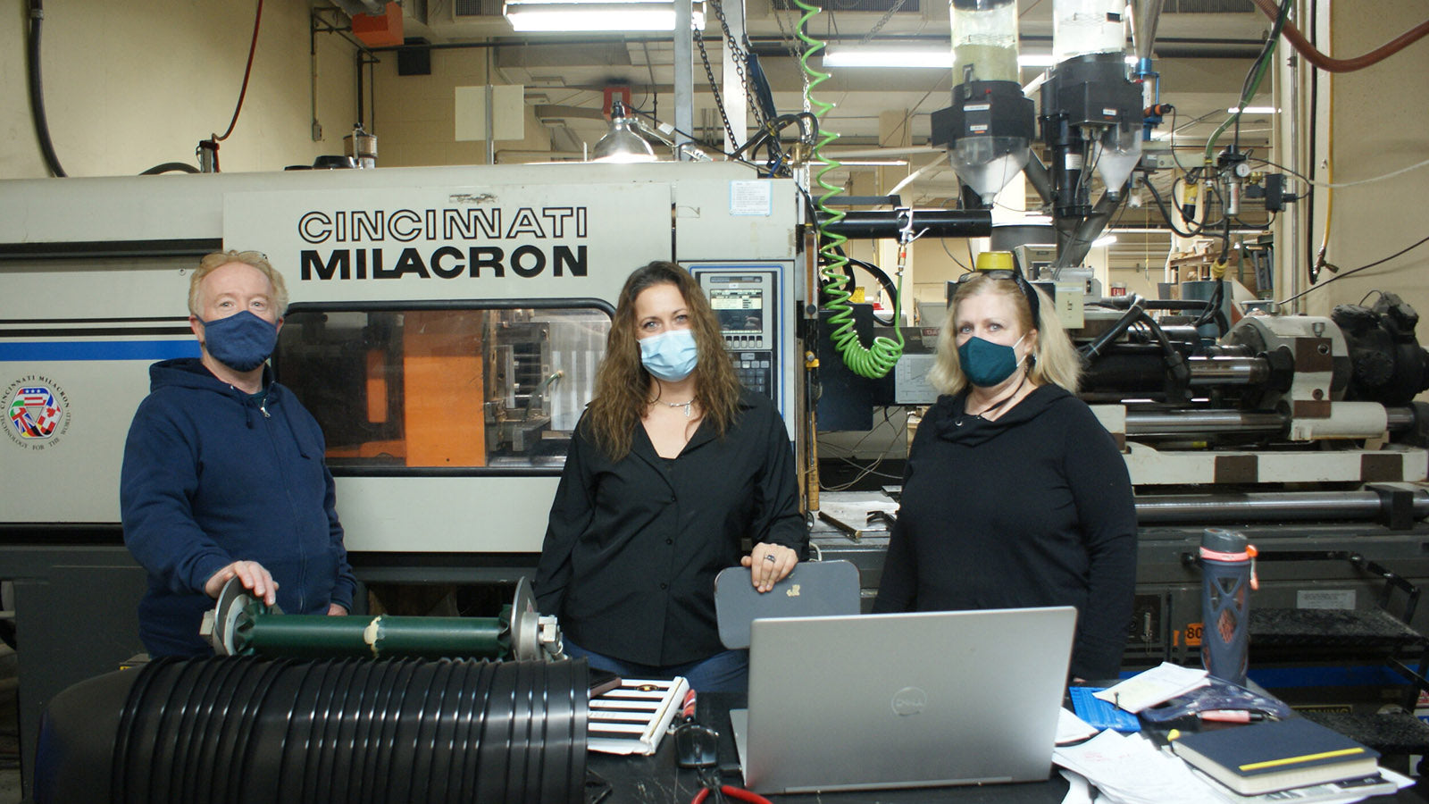 From Left: Dan Young of M-Tech Design with Alethea Schaeffer & Cynthia Marchetti of Usheco, Inc. at the machine used to manufacture SeadPods
