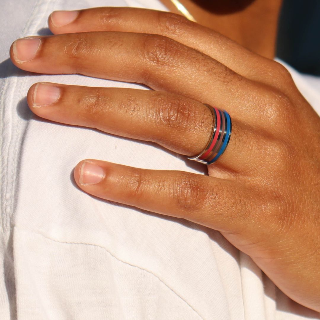 Bisexual pride ring on ring finger person resting their hand on their shoulder