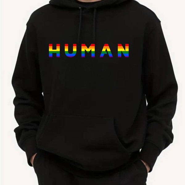 person wearing gay pride hoodie with the words HUMAN in rainbow on the chest