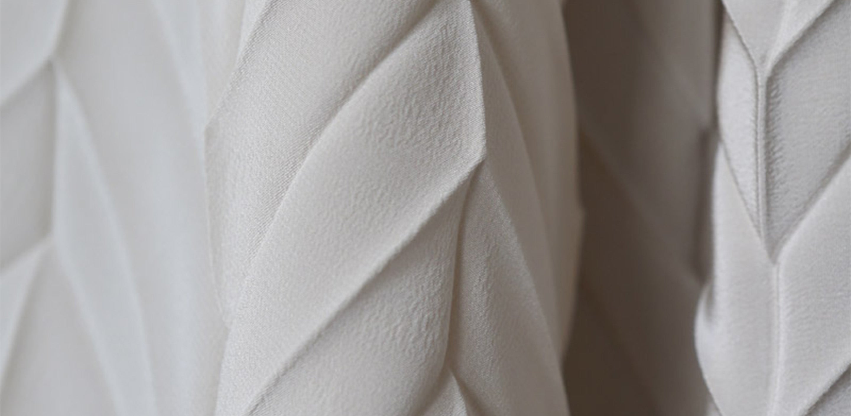 white herringbone pleated silk fabric