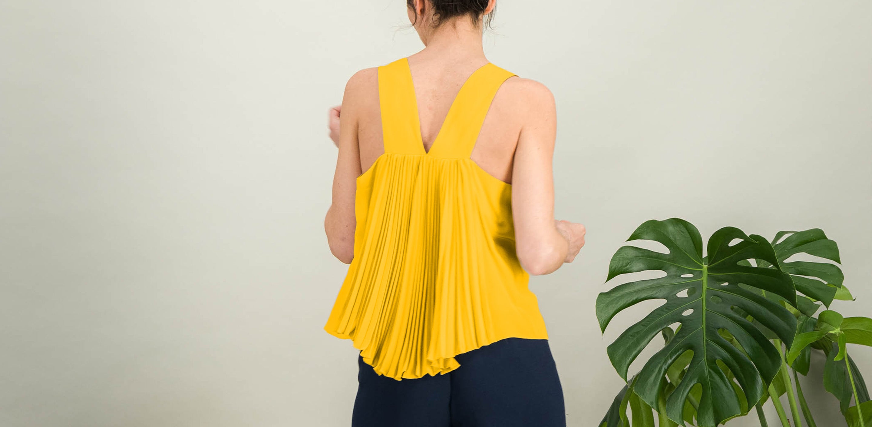 AMAYA ceremony top in yellow pleated silk, back view