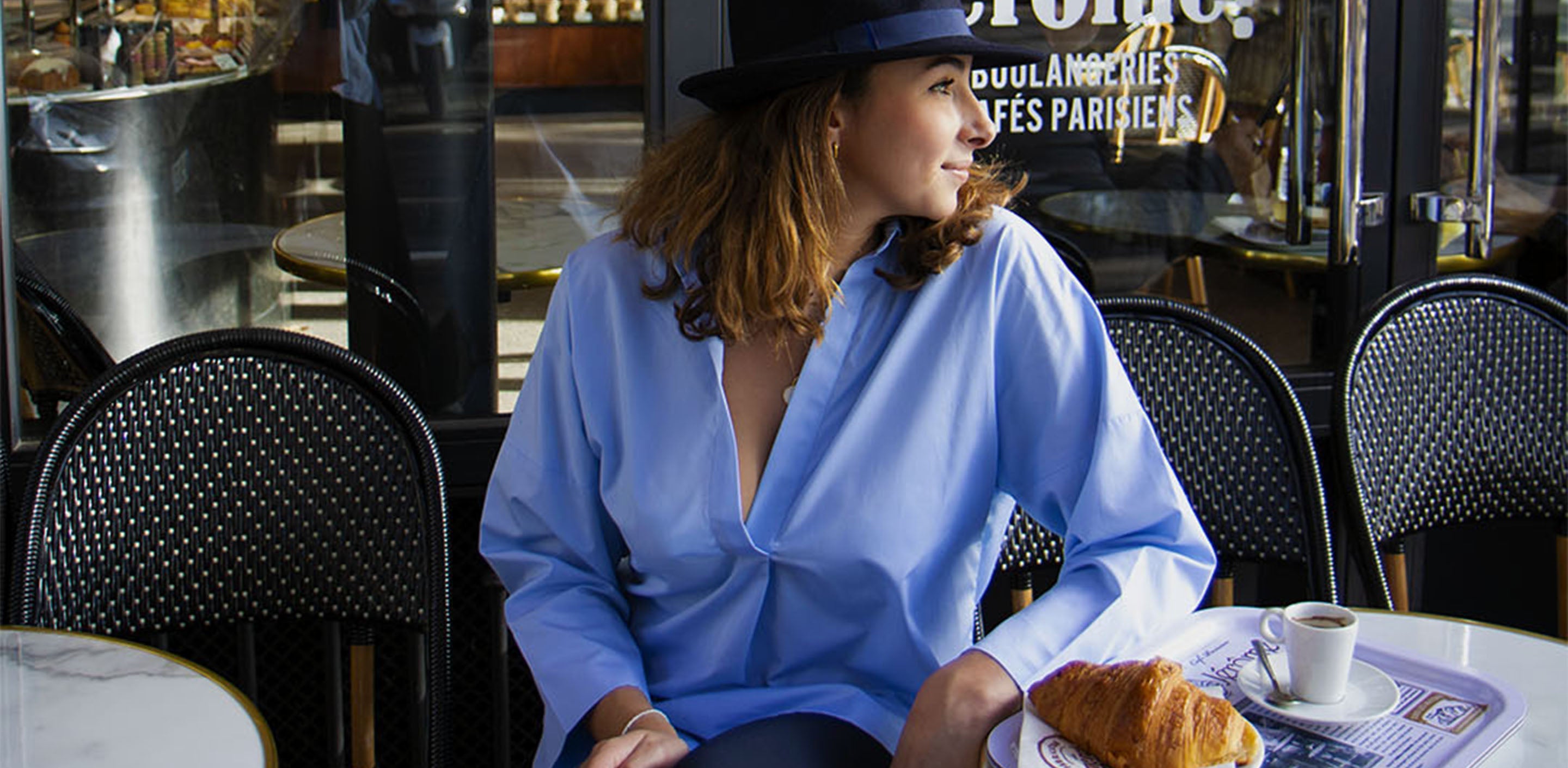 saint andre anahide shirt worn on the terrace of a parisian cafe
