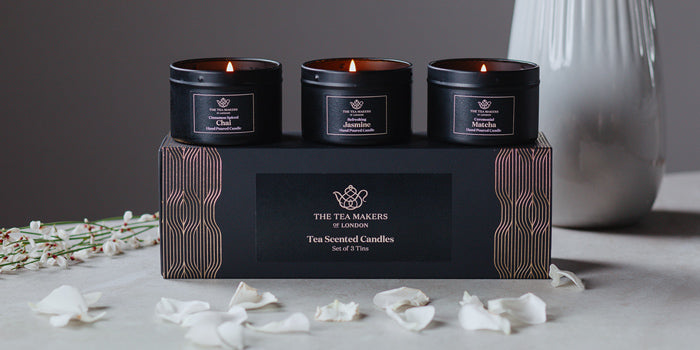 Trio of Tea Scented Travel Candles Gift set with white scattered flower petals