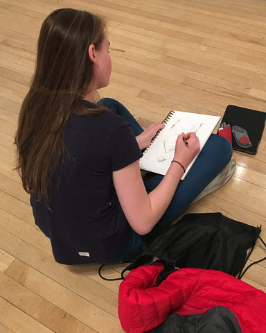 Girl sketching at the Tate Modern gallery