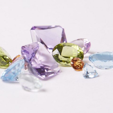 amethyst, aquamarine, beryl, blue topaz, citrine, diamond, fire opal, ioite, lemon quartz, morganite, peridot, rubellite, smoky quartz, tanzanite, tourmaline