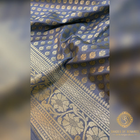 A beautiful Banarasi silk saree with intricate golden embroidery and vibrant colors.