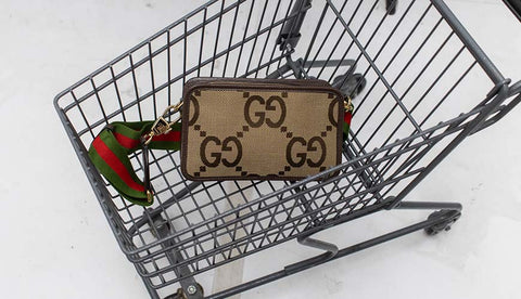 gucci bag from the newest collection preloved second hand in a small shopping cart