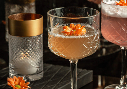 Fresh cocktail with edible flower.