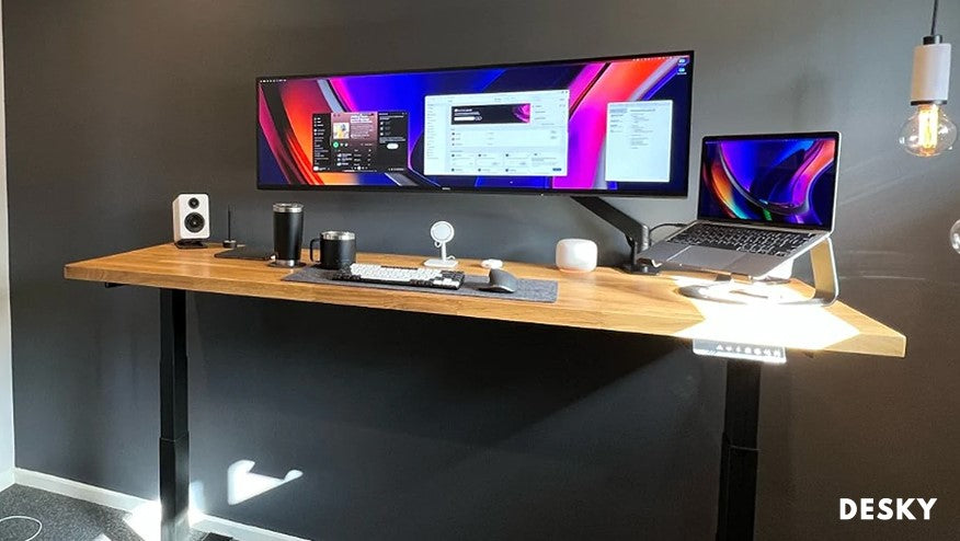 Curved monitor on a wide desk laptop setup