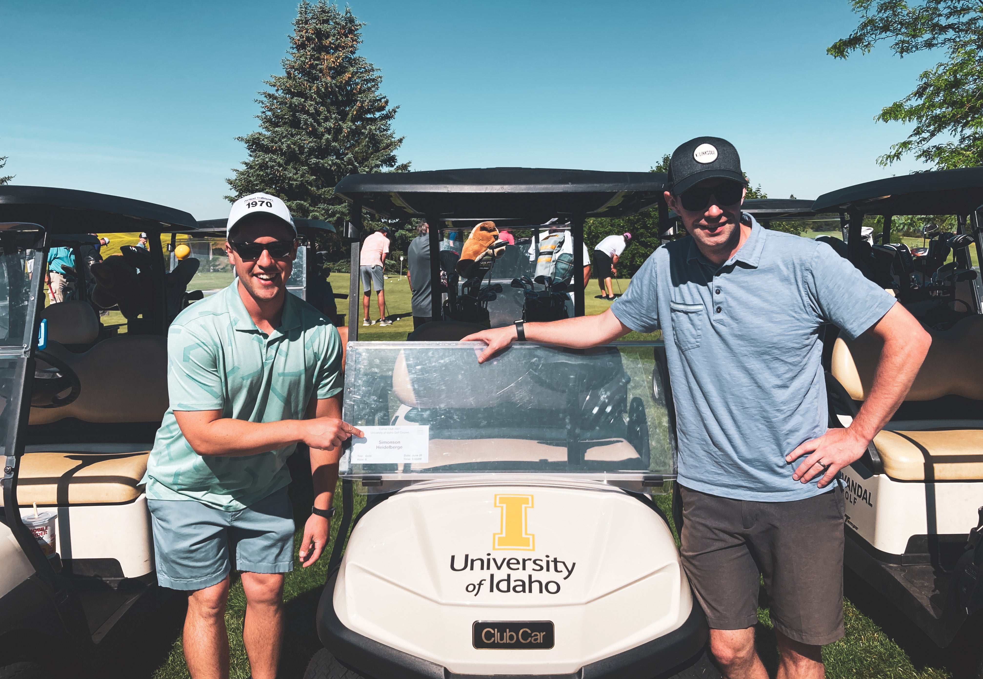 joe simons and nick heidelberger at the university of idaho golf course at the turn podcast hosts
