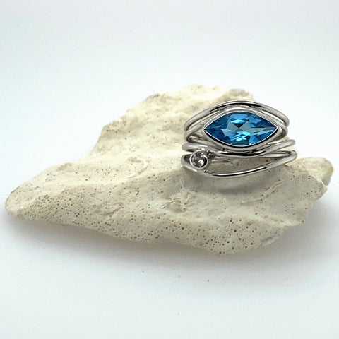 silver ring with blue topaz gem