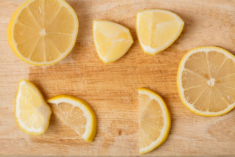 Visual representation of maintenance tips for a wood cutting board, including applying lemon.