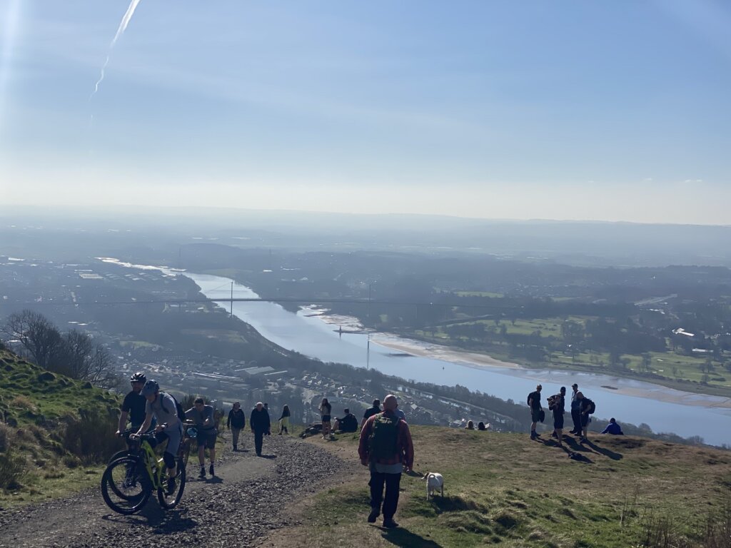 crowds climb Kilpatrick Hills