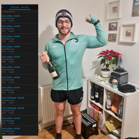 Male runner flexing bicep holding champagne