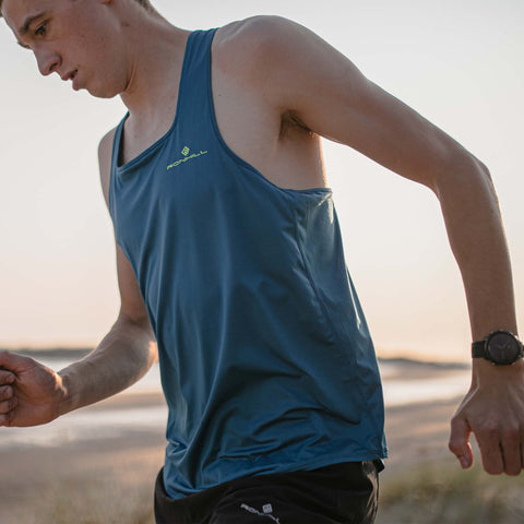 Close up of man running with GPS watch on