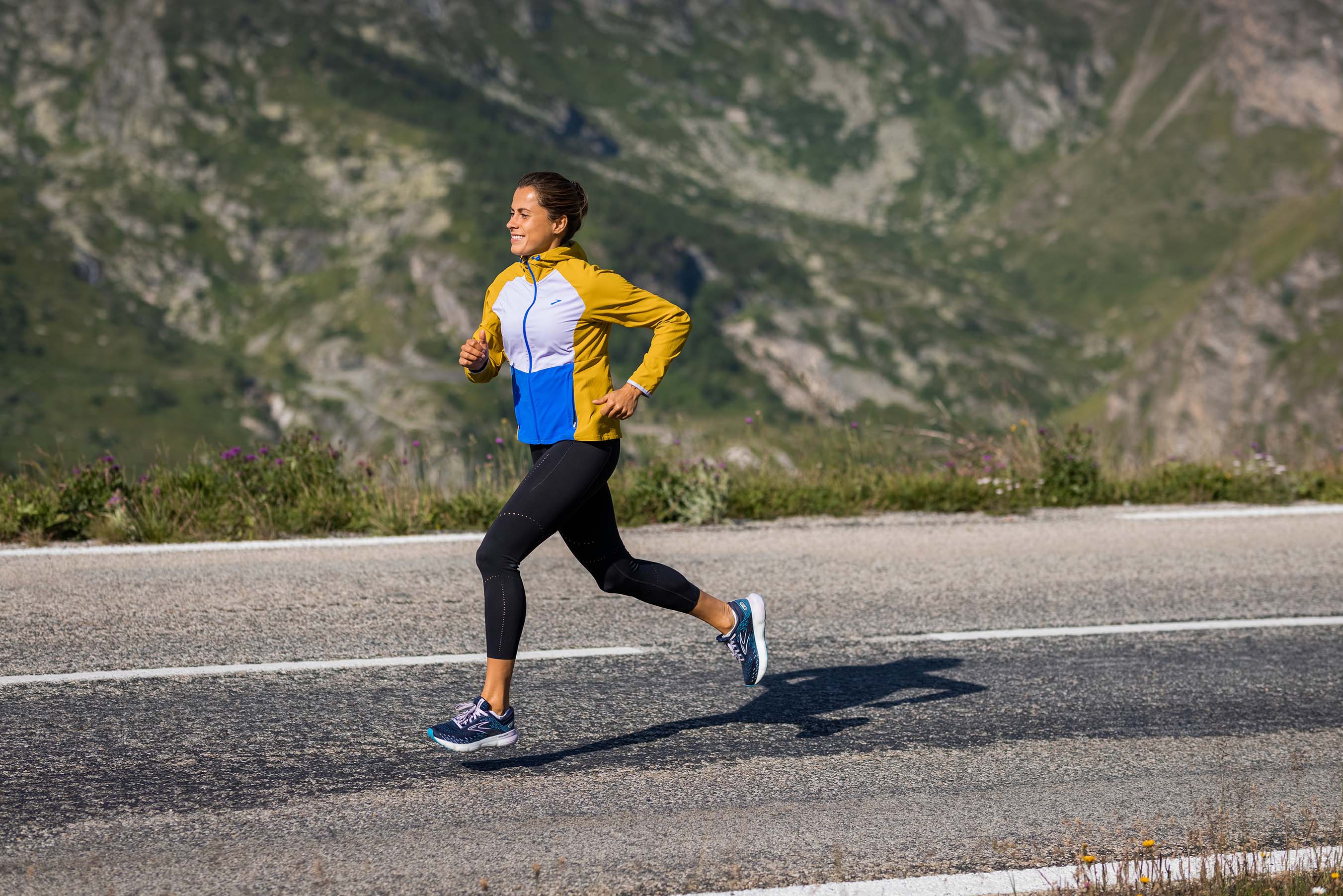 Woman running in jacket in the heat
