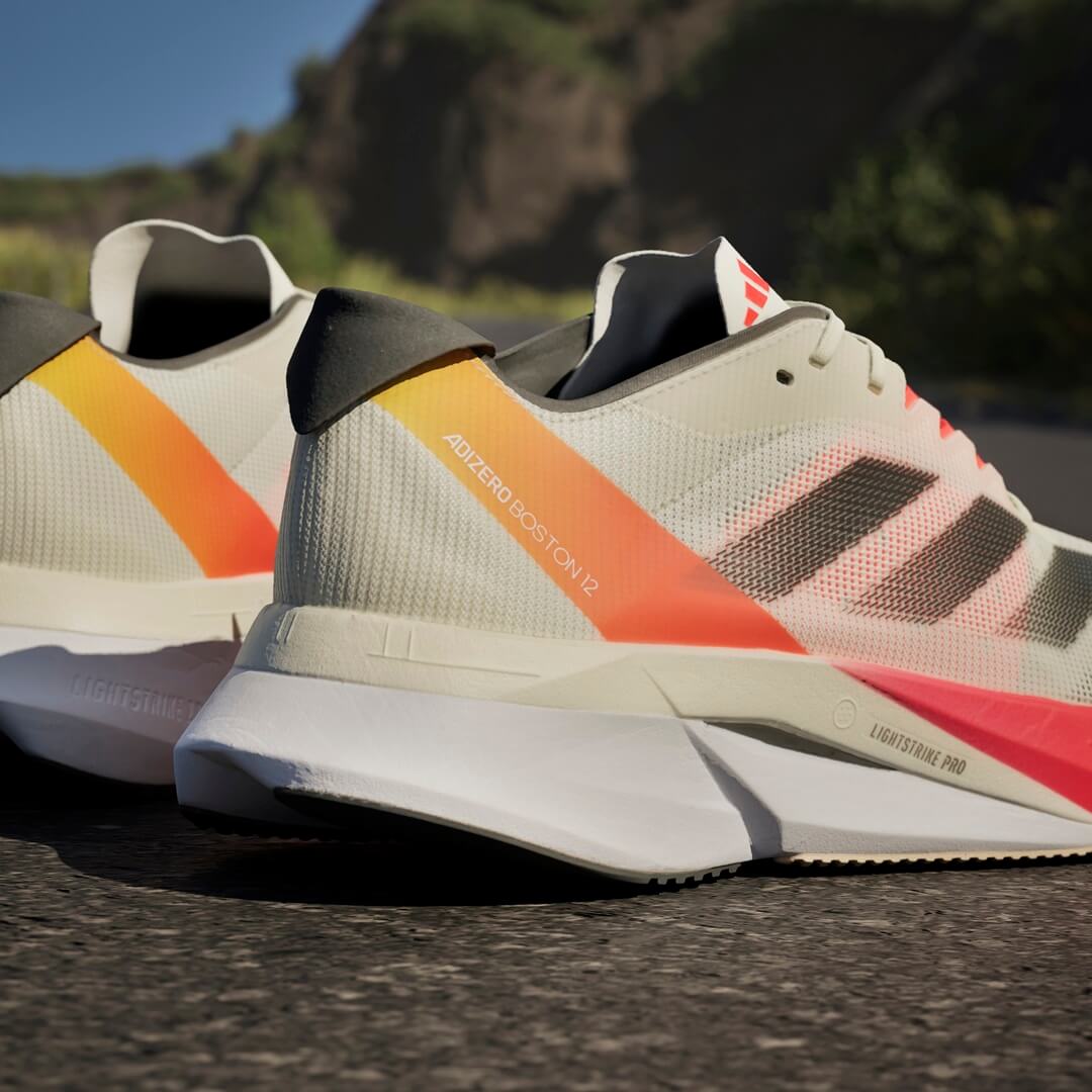Heel view of adidas Adizero Boston 12 running shoes in Ivory/Core Black/Solar Red colourway