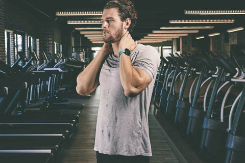 Runner wearing a Garmin watch in the gym