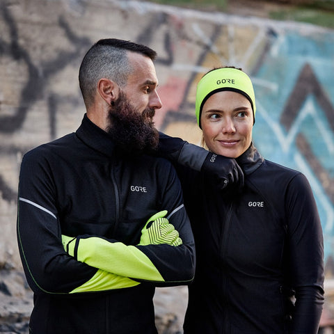 Male and female runners wearing GORE® Wear clothing