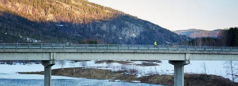 Runner crossing a bridge