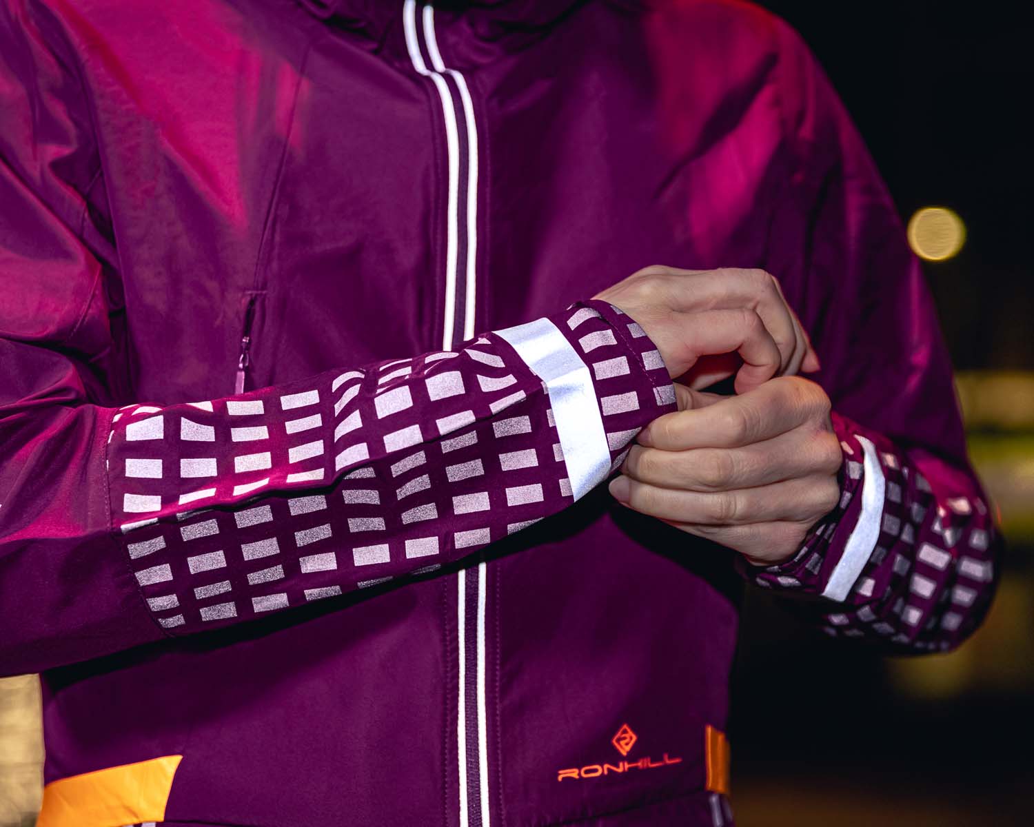 Close up of reflective panels on purple jacket 