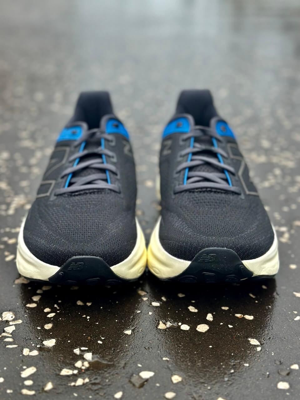 Pair of Men's New Balance Fresh Foam X 1080 V13 running shoes facing forward on tarmac road