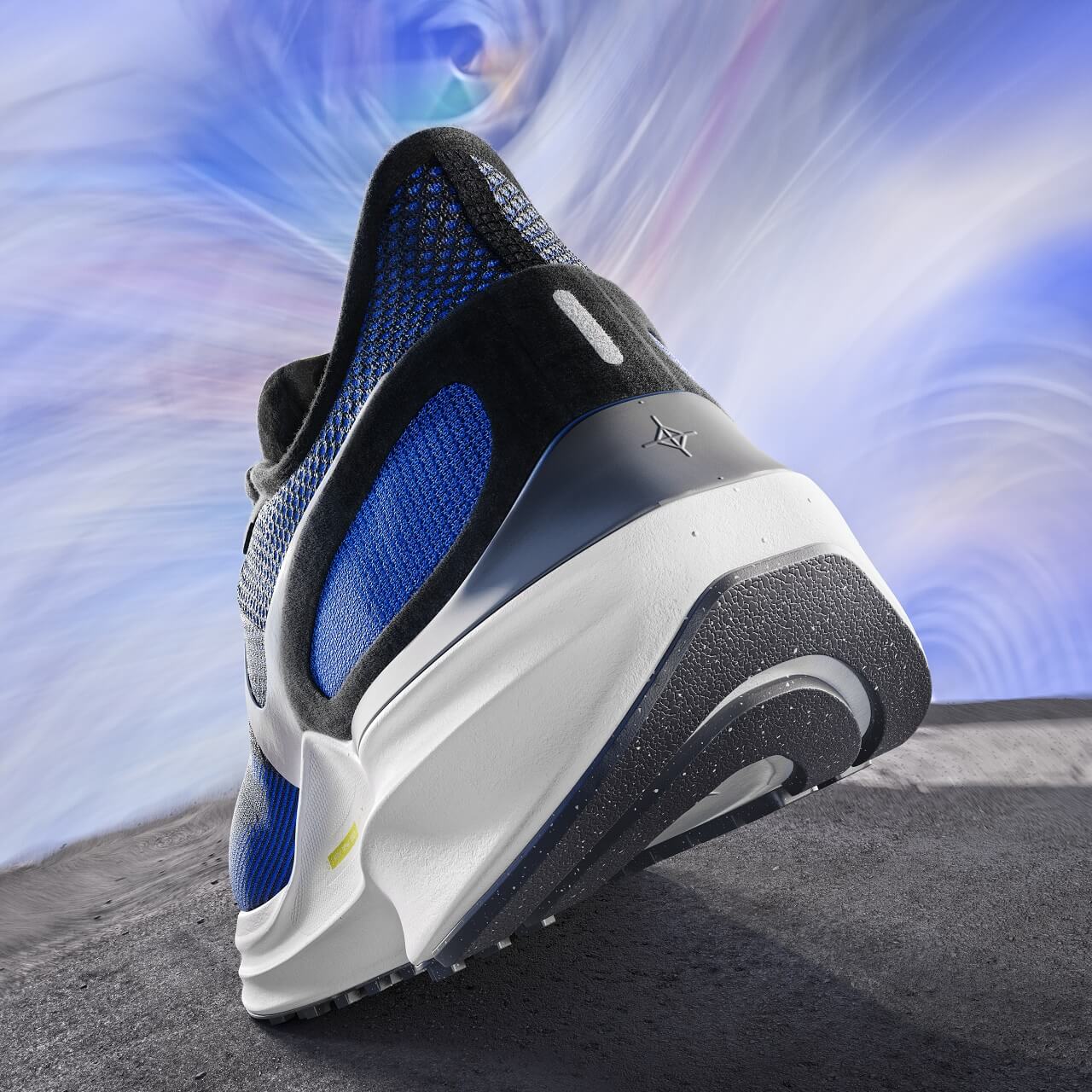 Rear view of running shoe agains blue sky