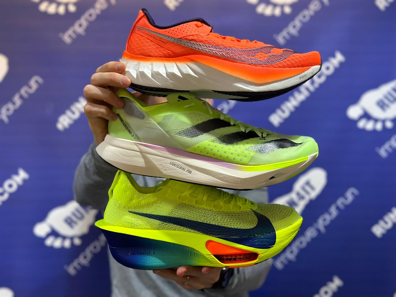 3 running shoes stacked on top of each other