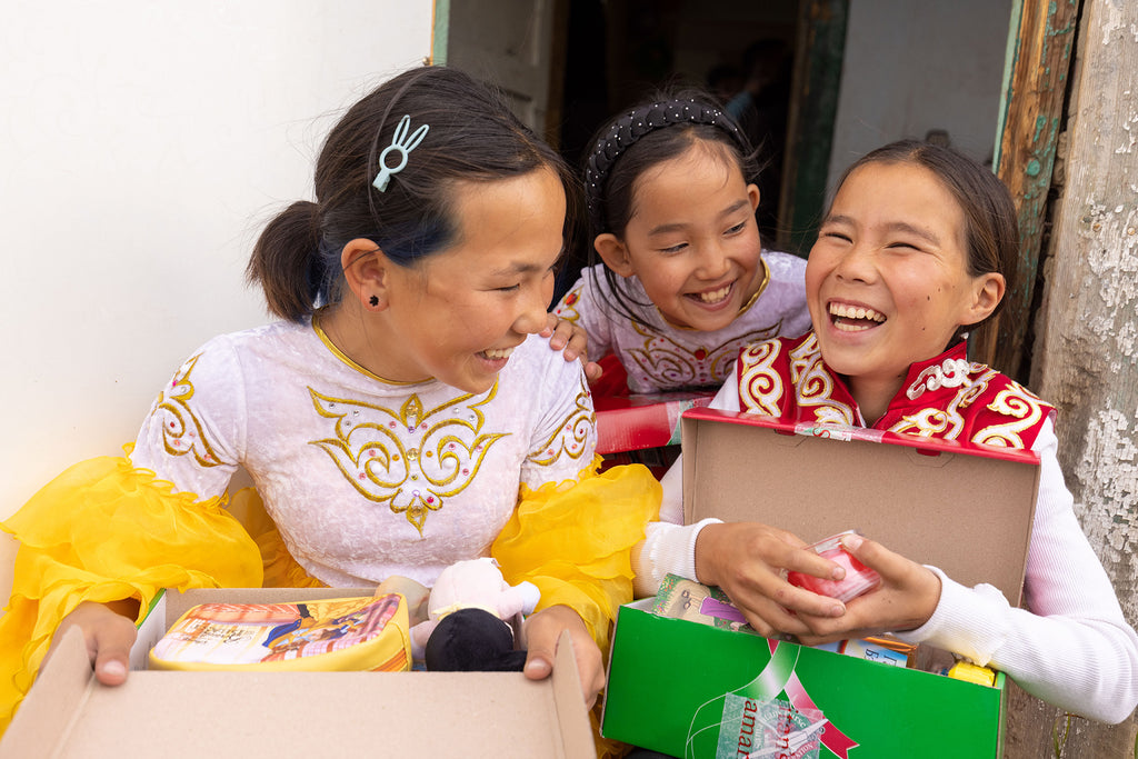 Mongolian girls receiving shoe box gifts