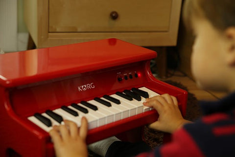 tinyPIANO DIGITAL TOY PIANO Support Learn More Event Related Products  LP-380  SP-170DX  B1 LP-180 SP-280 News 2014.01.23 Korg announces new products at Winter NAMM 2014. Twenty-five built-in sounds that let you learn while playing   Good sound is not limited to grand piano tones. There are a total of 25 built-in sounds including sounds that you've heard in classic songs, such as electric piano, clavinet, organ and bell, as well as sounds that befit a miniature piano, such as music box and toy piano tones. You can learn the sounds of instruments while actually playing them, as if the tinyPIANO itself were a picture book of instruments. Fifty built-in demo songs to enjoy even when you're not playing   The tinyPIANO contains 50 automatically playing demo songs that cover a wide range of styles. In addition to being a great way to hear skillful performances, these songs can provide enjoyable background music for your room, like a music box. Each demo song is assigned to play using a tone that's appropriate for it, but you are free to specify a different tone to suit your taste or the desired atmosphere. Even when playing back the demo songs at night, you can turn down the volume and enjoy the background music without disturbing those around you. Small, easily transportable, and powered by AA batteries