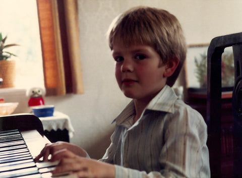 Luke at the piano, aged five.