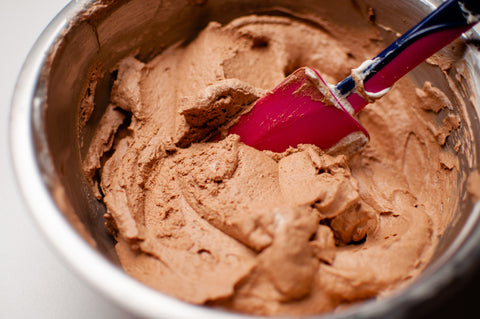 Creamy vegan chocolate mousse being whisked to a smooth, luxurious consistency
