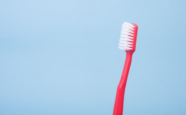 Red toothbrush that can be used for tonsil stones.