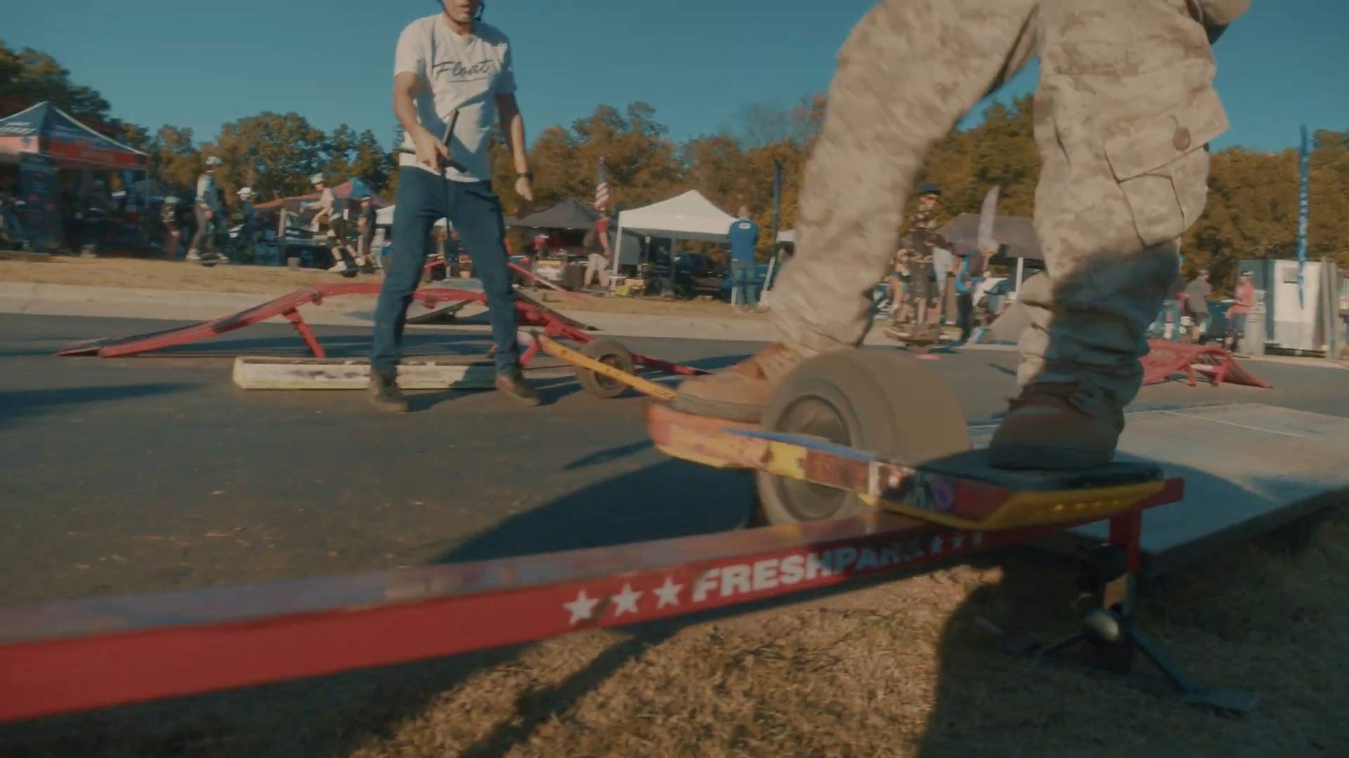 Onewheel Jump and Tricks with ramps and grind rails at floatlife fest