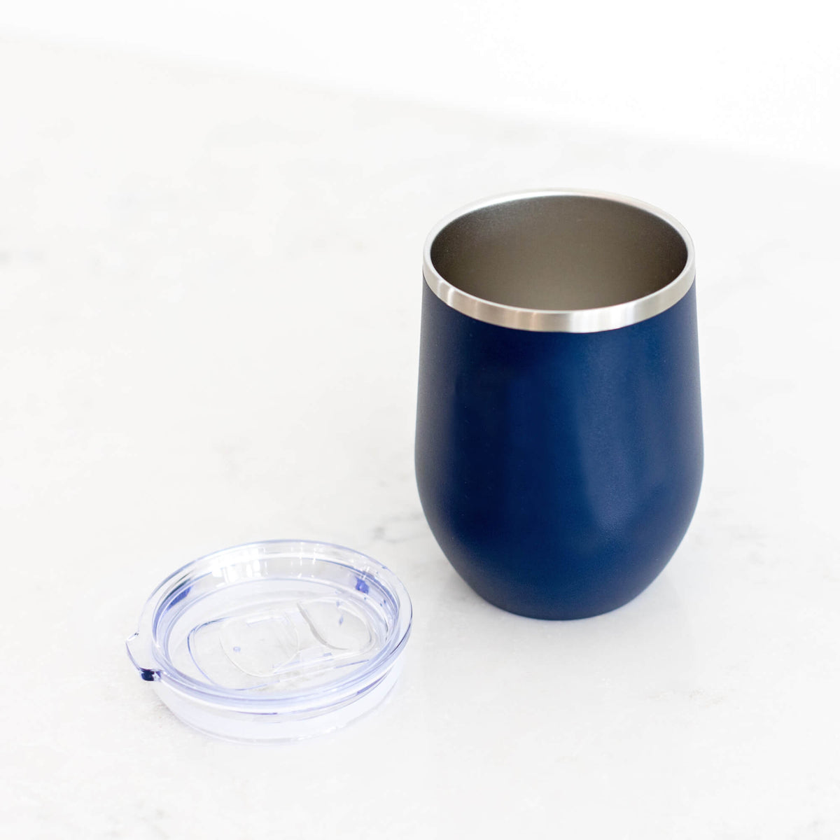 https://cdn.shopify.com/s/files/1/0570/4935/0281/products/WIne-Tumbler-Open-Navy-Blank_8f74e7d7-f8c5-4bab-81ee-631bb9a80654_1200x.jpg?v=1690398318