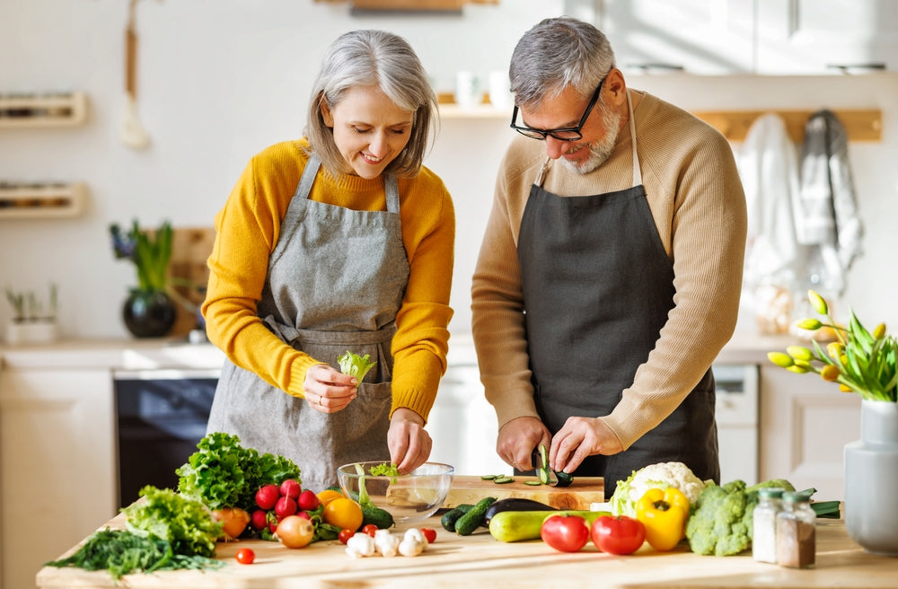 An elderly couple cutting vegetables for a healthy meal - CPAP Depot
