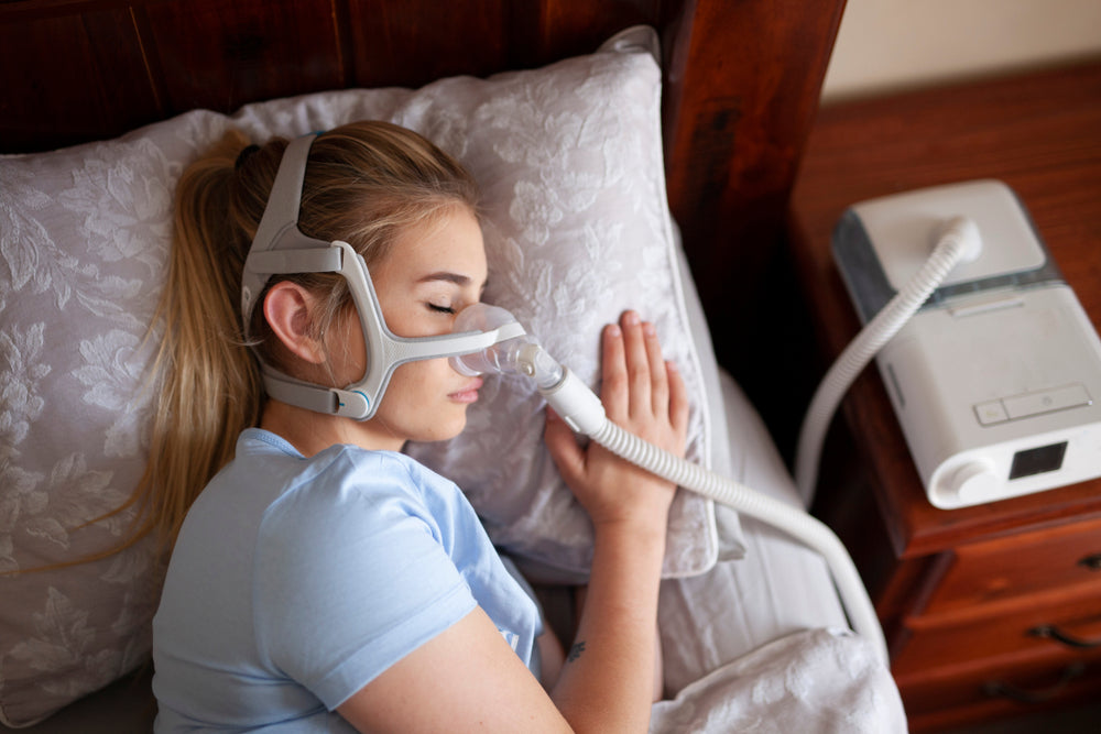 Girl sleeping while using a CPAP Machine - CPAP Depot