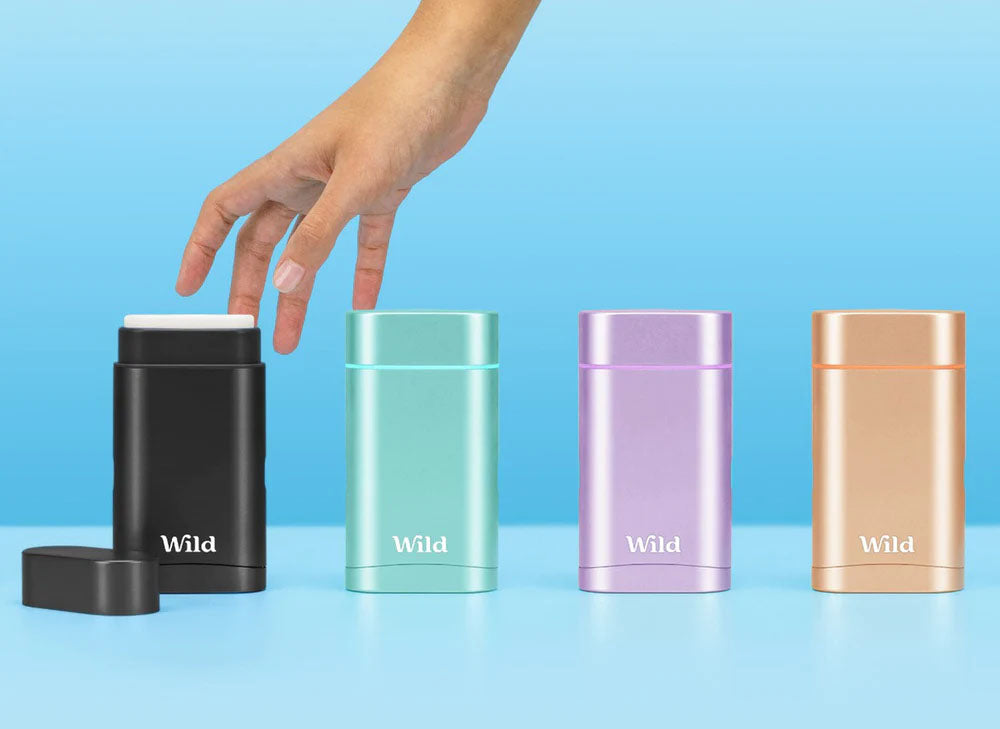 wild deodorant cases in a line on blue background