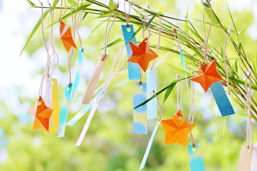Colorful Tanabata paper strips filled with wishes are hung on bamboo branches