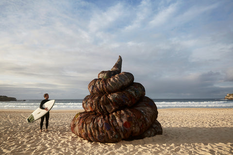 Giant plastic poop and surfer on Bondi Beach World environment day 2023