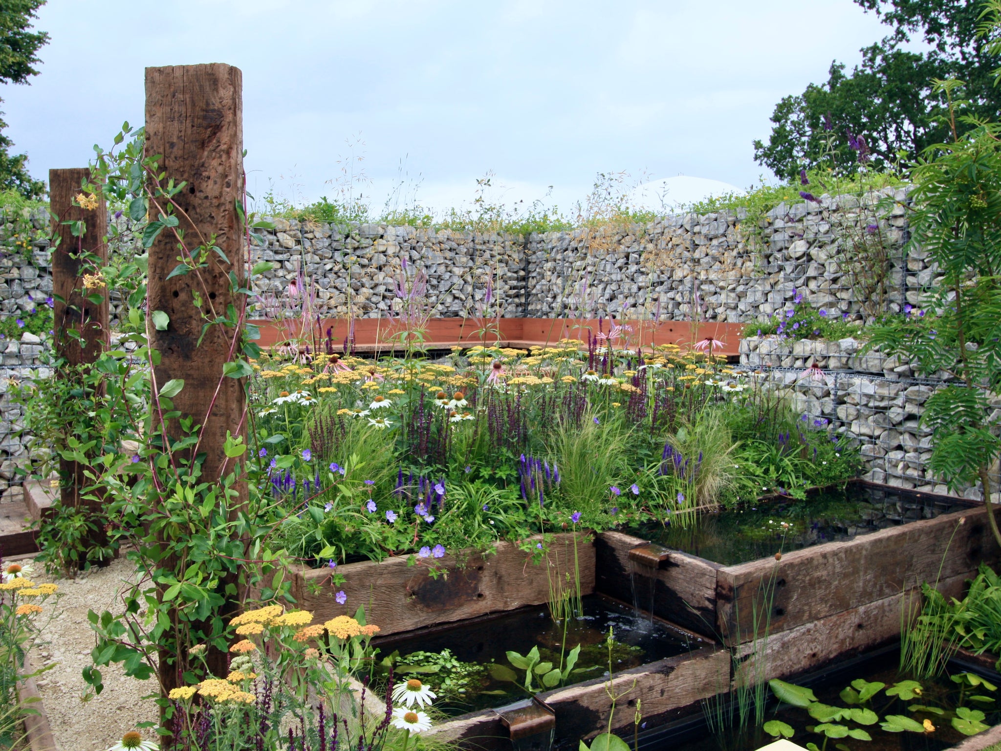 Stone filled gabions in the Nurturing Nature in the City garden, Hampton Court Flower Festival  2023