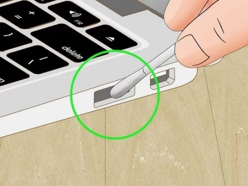 Carefully insert the toothpick into the USB-C port