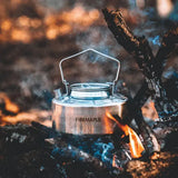 Fire Maple stainless steel kettle over a campfire