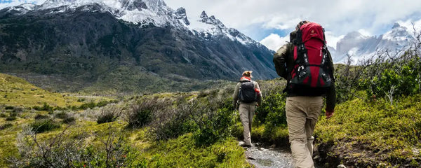 Two people hiking in the mountains